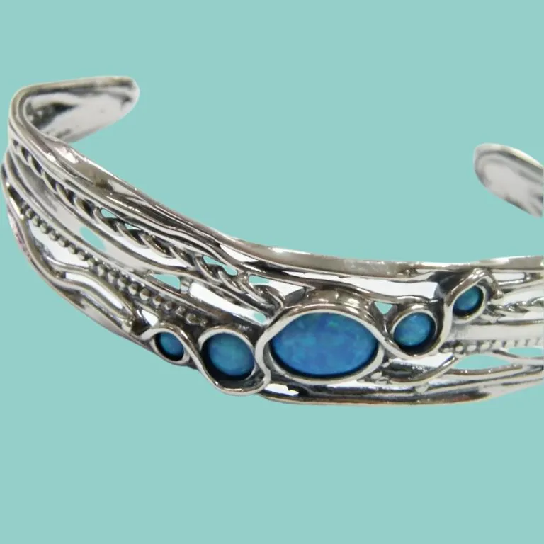 Cuff Bracelet made of sterling silver set with blue opals